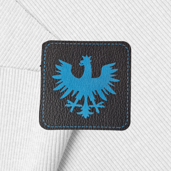 Kunstlederlabel "Tiroler Adler 5x5cm eckig, Blau/Schwarz"